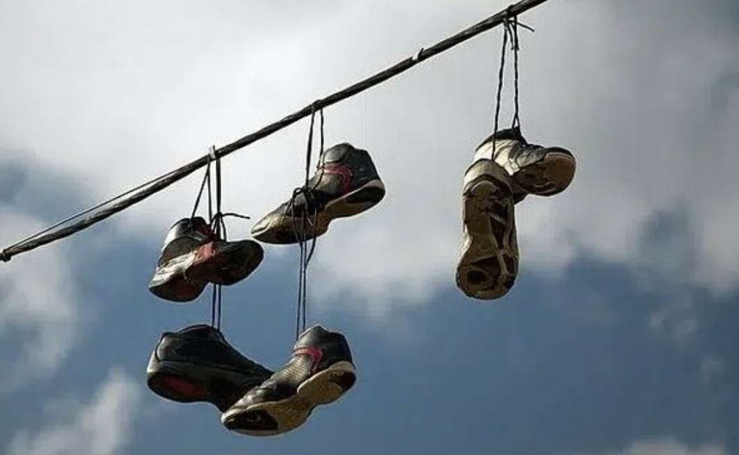 The Mystery of Shoes Hanging from Power Lines