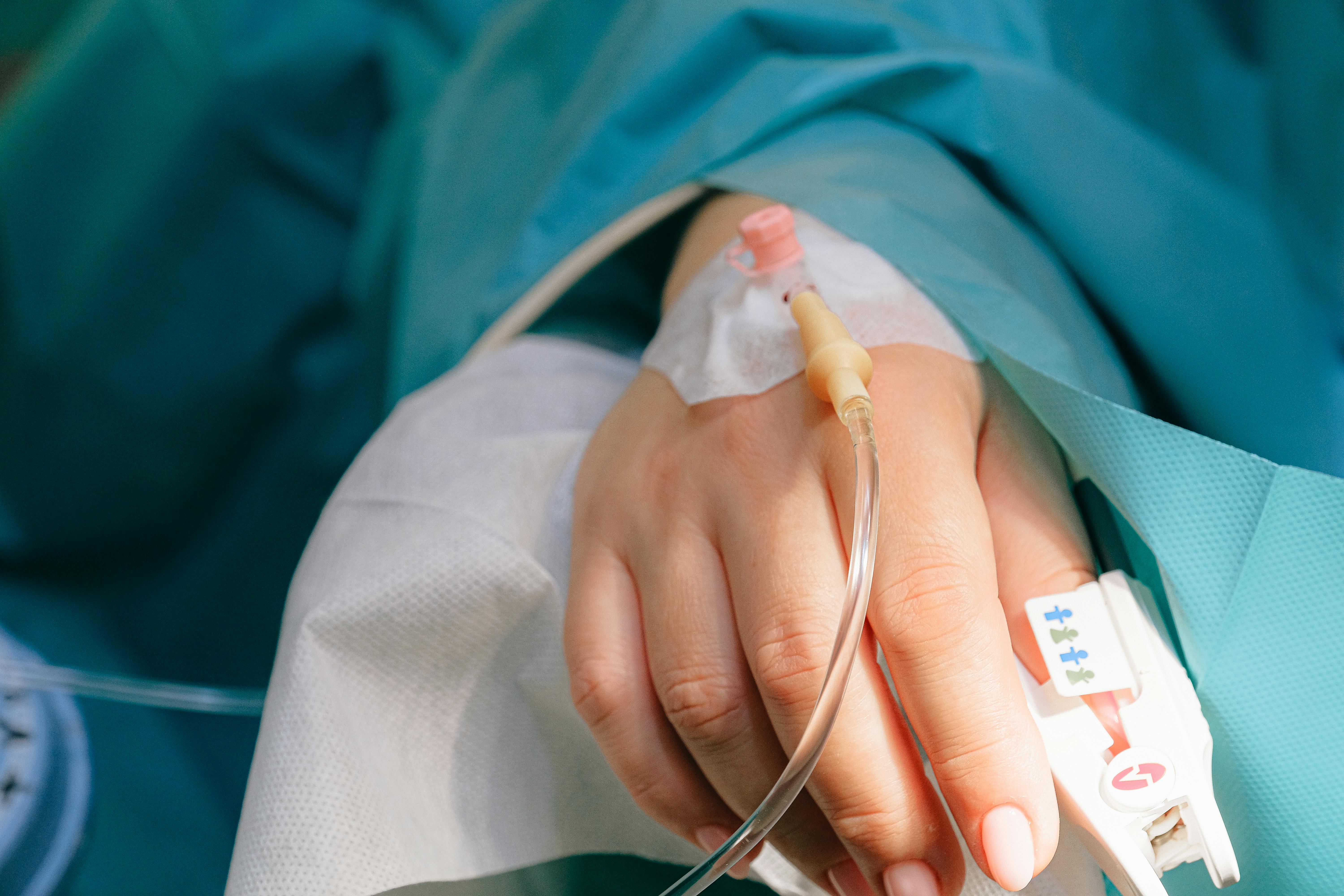 A woman's hand with a hospital drip